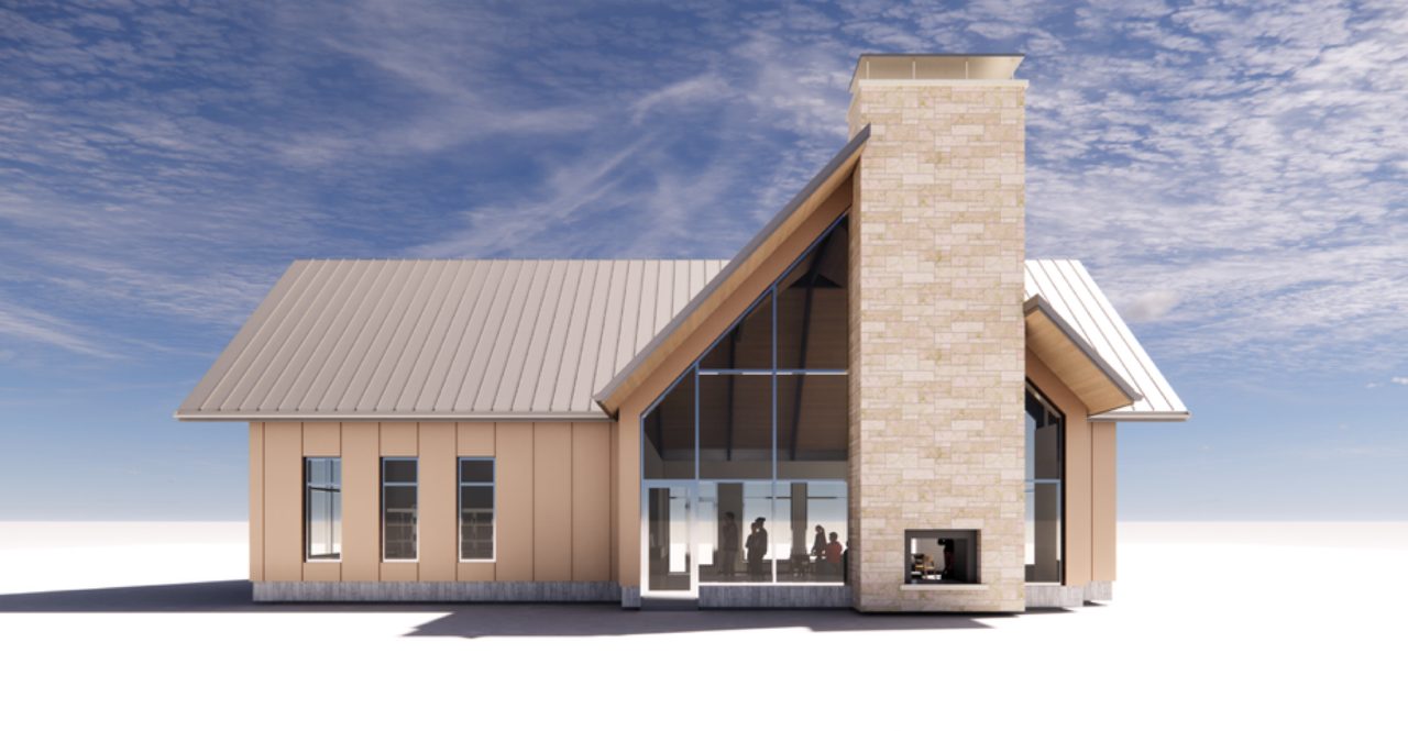 Gabled building with stone chimney